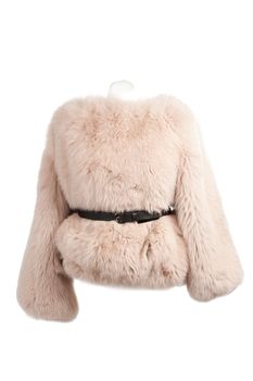 Expensive fur coats collection on a mannequin on white background