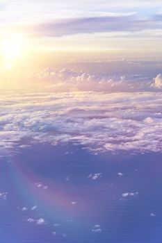 dramatic cloudscape with dramatic clouds reflecting the rays of sunset light.