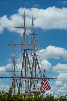 American Flag on Front of Tall Masted Sailboat