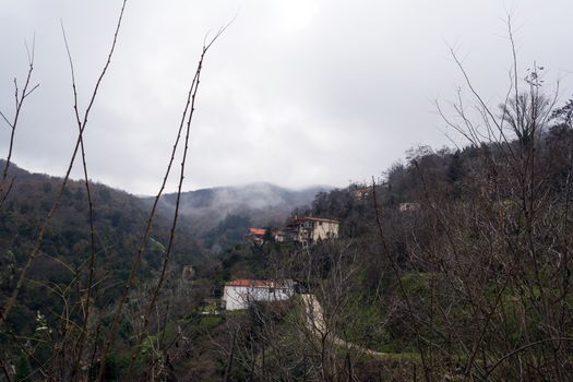 Image of village in the mountains with fog, Arcadia, Greece.