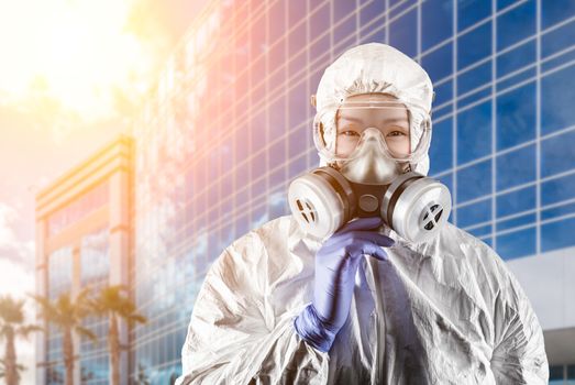 Chinese Woman Wearing Hazmat Suit, Protective Gas Mask and Goggles In Front of City Building.