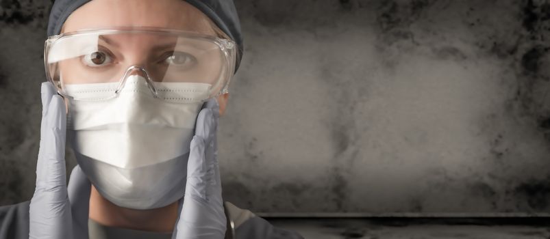 Female Doctor or Nurse Wearing Scrubs, Protective Face Mask and Goggles Banner.