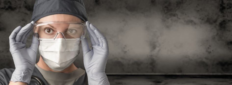 Female Doctor or Nurse Wearing Scrubs, Protective Face Mask and Goggles Banner.