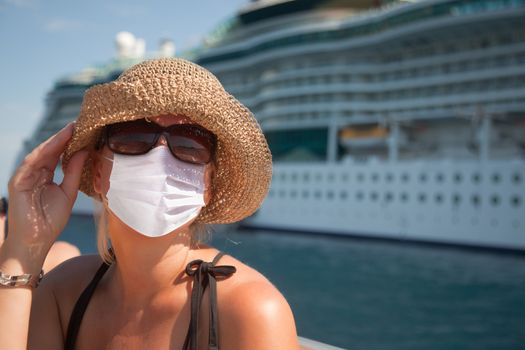 Young Adult Woman Wearing Face Mask on Tender Boat With Passenger Cruise Ship Behind..