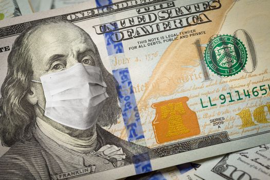 One Hundred Dollar Bill With Medical Face Mask on Face of Benjamin Franklin.