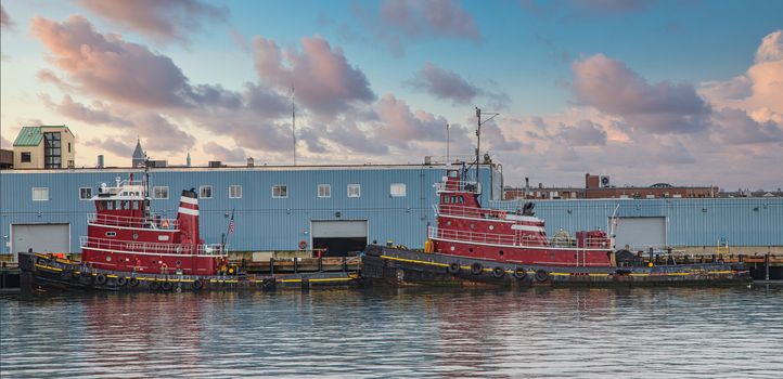 Red Tugboats tied up in a harbor in Portland, Maine