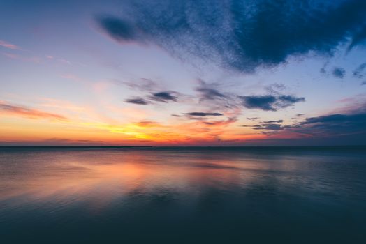 Sunrise on Volga river with sky reflected on water