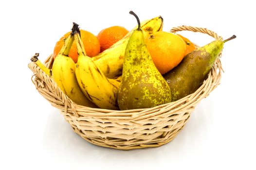 Healthy food. Organic fruits and vegetables, bananas, clementines, pears on a wooden background