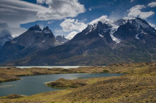 Nordenskjold lake and Cordillera Paine with the Paine Horns in the foreground and the Towers of Paine in the background. Torres del Paine National Park. Magallanes and Chilean Antarctic Region. Chile.