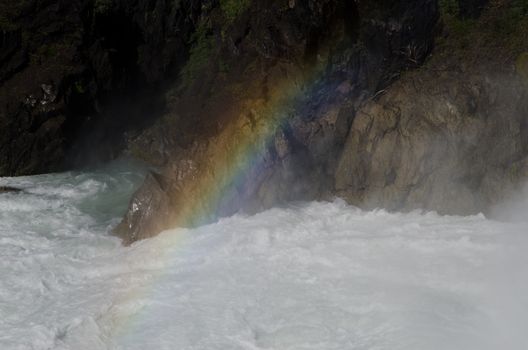 Rainbow over the Salto Grande waterfall. Torres del Paine National Park. Ultima Esperanza Province. Magallanes and Chilean Antarctic Region. Chile.