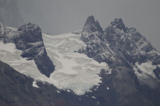 Cliffs and glacier in Torres del Paine National Park. Ultima Esperanza Province. Magallanes and Chilean Antarctic Region. Chile.