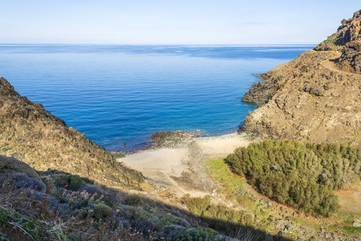 Wild rock beach with natural rock formation. It is located near the gorge of Richtis. Winter, Crete, Greece.