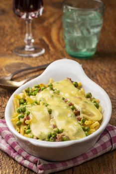 rigatoni emiliana in a casserole on wood