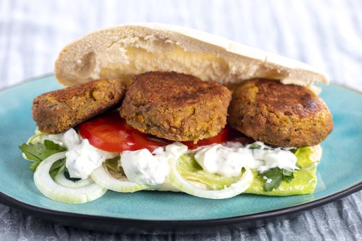 falafel in pita bread on a plate