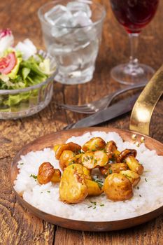 italian risotto with chanterelles on wood