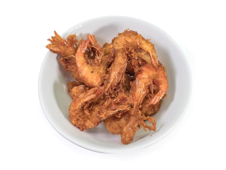 The close up of deep fried shrimp in white bowl on white background.