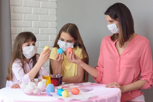 Mom and two quarantined daughters painted eggs for Easter
