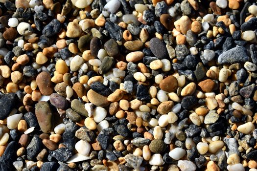 A close up of pebbles on the beach.