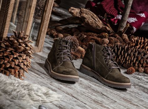 Different shoes on an old wooden background