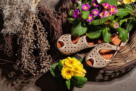 Different shoes with accessories on a studio background