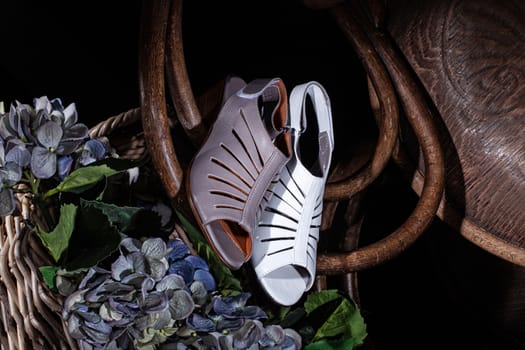 Woman's shoes and accessories on a studio background