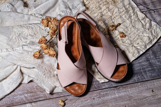 Woman's shoes and accessories on a studio background