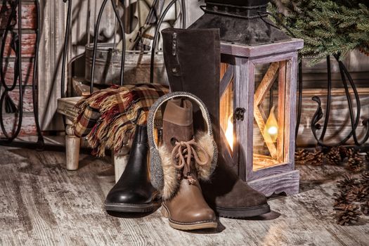 Different kinds of shoes on a wooden desk