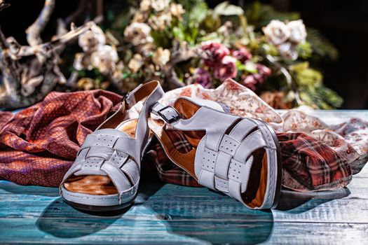 Woman's shoes and accessories on a studio background