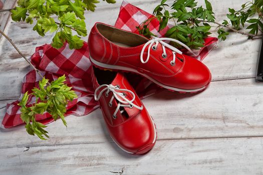 Different shoes on an old wooden desk