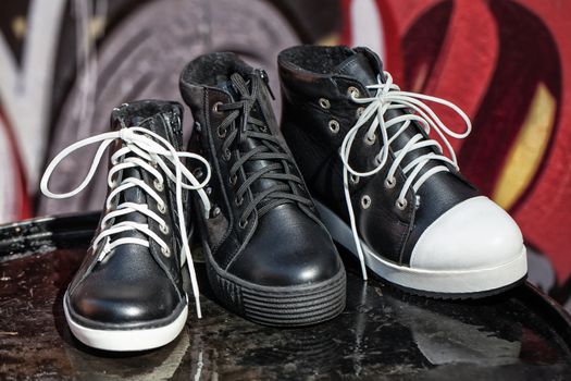 Different kinds of shoes on a natural background