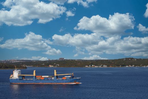 Freighter sailing through calm blue waters off the coast of Halifax