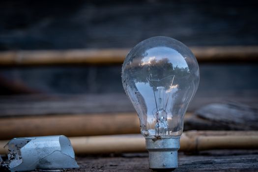 A Dirty Old and unused Light Bulb with blur background