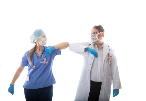 Doctor and nurse healthcare workers elbow bump instead of shaking hands during icontagious nfluenza pandemic such as SARS or COVID-19