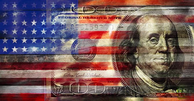 USA flag with US dollar on a wood surface. Concept image