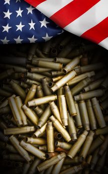 American flag isolated on shotgun cartridges background. Top view, copy space for text.