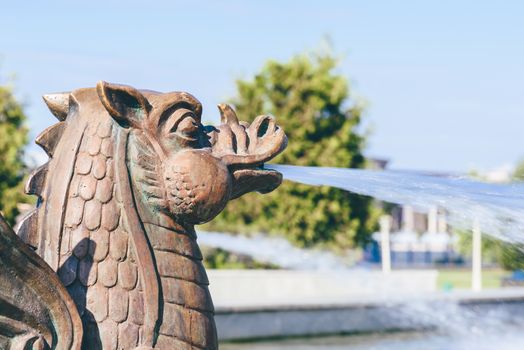 Metal dragon fountain in sumer day in Kazan, Russia