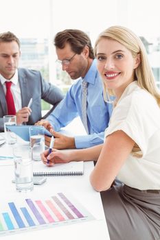 Young business people in board room meeting at office