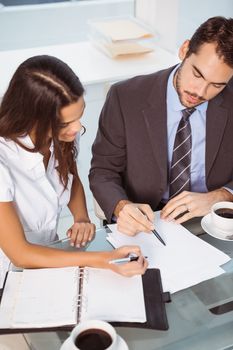 Two young business people in meeting at office