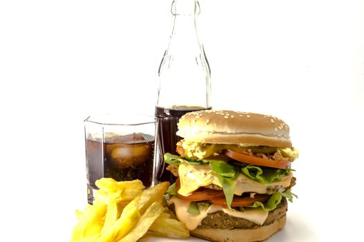 Double meat and cheese burger with fresh fries and a coke on a white background