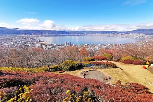 Japan outdoor park, resident buildings, near bay with white cloud and blue sky