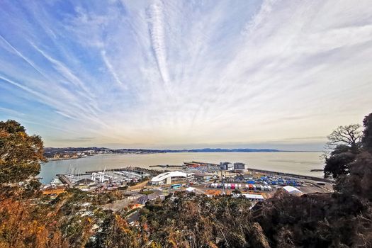 Japan town, resident buildings, outdoor park near bay with white cloud and blue sky