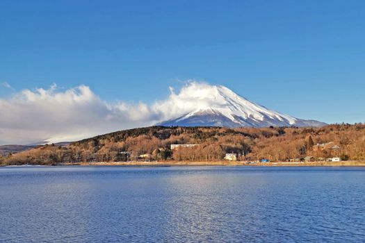 The lake, sky and Fuji mountain with snow in Japan countryside