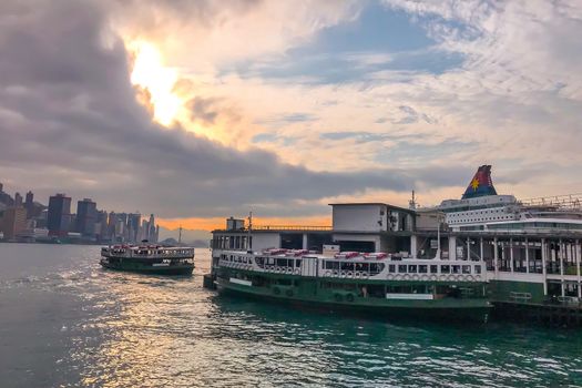 The Hong Kong traditional ferry near the city pier with dramantic sky