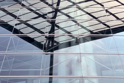 The exterior roof top and exterior glass window of modern exhibition center building in Hong Kong city
