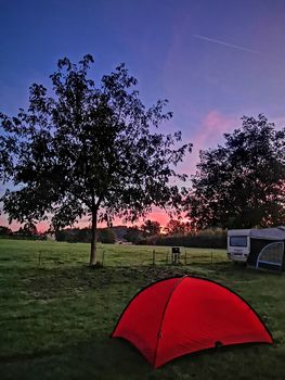 The vertical outdoor camping tent in Switzerland countryside campsite