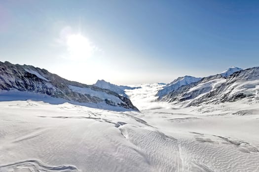 The peak of Switzerland Grindelawld snow mountain with cloud sea