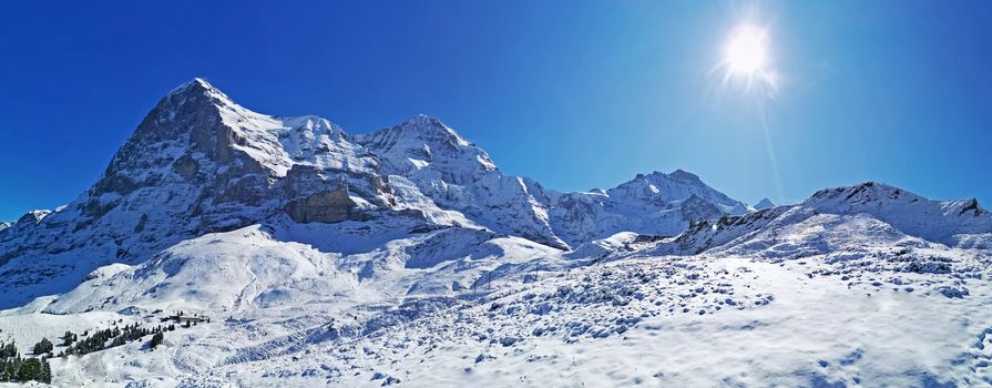 The peak of Switzerland Grindelawld snow mountain with blue sky

