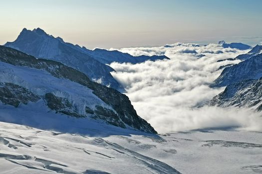 The peak and sea of clouds in Switzerland Grindelawld snow mountain
