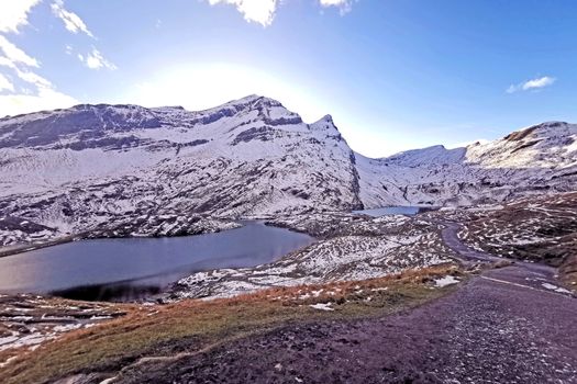 The snow mountain, clouds, blue sky, lake in Switzerlnd park