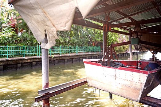 The fishing boat,plants; temple,river in Thailand village